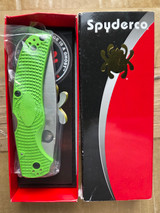 Used Spyderco Native Chief Salt folding knife with thumb hole - sleeve and tray with knife and paperwork in tray shown.  Satin LC200N stainless steel plain edge blade.  Green FRN handle.  Model C244PGR.