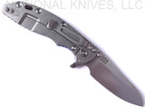 Rick Hinderer Knives Skinny XM-18 3.5" Sheepsfoot folding knife with thumb stud and flipper tab - shown open lock side.  Stonewash 20CV stainless steel plain edge blade.  Blue - black G-10 handle with stonewash lock side.  Model K2525SGS00.
