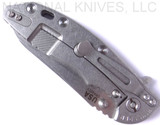 Rick Hinderer Knives Skinny XM-18 3.5" Sheepsfoot folding knife with thumb stud and flipper tab - shown closed lock side.  Stonewash 20CV stainless steel plain edge blade.  Blue - black G-10 handle with stonewash lock side.  Model K2525SGS00.
