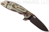 Rick Hinderer Knives Vintage Series XM-18 3.0" Spear Point folding knife with thumb studs and flipper tab - shown open lock side.  Black O-1 steel plain edge blade.  Smooth Walnut handle with Battle Green lock side.  Model K1081S0VT-SM.
For reference only.