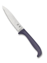 Spyderco Culinary Counter Puppy kitchen knife - presentation side shown.  Satin 7Cr17 stainless steel serrated edge blade.  Purple polypropylene handle.  Model K20SPR.
