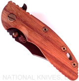 Rick Hinderer Knives Vintage Series XM-18 3.5" Bowie folding knife with thumb stud and flipper tab - shown closed presentation side.  Black O-1 steel plain edge blade.  Smooth Walnut handle with Battle Green titanium lock side.  Model K2032S0VT.
For reference only.