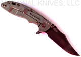 Rick Hinderer Knives Vintage Series XM-18 3.5" Bowie folding knife with thumb stud and flipper tab - shown open lock side.  Black O-1 steel plain edge blade.  Textured Walnut handle with Battle Green titanium lock side.  Model K2032S0VT.
For reference only.