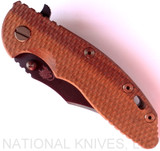 Rick Hinderer Knives Vintage Series XM-18 3.5" Bowie folding knife with thumb stud and flipper tab - shown closed presentation side.  Black O-1 steel plain edge blade.  Textured Walnut handle with Battle Green titanium lock side.  Model K2032S0VT.
For reference only.