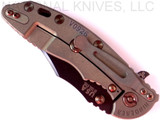 Rick Hinderer Knives Vintage Series XM-18 3.5" Bowie folding knife with thumb stud and flipper tab - shown closed lock side.  Black O-1 steel plain edge blade.  Textured Walnut handle with Battle Green titanium lock side.  Model K2032S0VT.
For reference only.