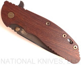 Rick Hinderer Knives Vintage Series XM-24 Spear Point folding knife with thumb stud and flipper tab - shown closed presentation side.  Black O-1 steel plain edge blade.  Smooth Walnut handle with Battle Green lock side.  Model K3083S0VT00.
For reference only.