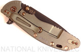 Rick Hinderer Knives Vintage Series XM-24 Spear Point folding knife with thumb stud and flipper tab - shown closed lock side.  Black O-1 steel plain edge blade.  Smooth Walnut handle with Battle Green lock side.  Model K3083S0VT00.
For reference only.