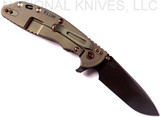 Rick Hinderer Knives Vintage Series XM-24 Spear Point folding knife with thumb stud and flipper tab - shown open lock side.  Black O-1 steel plain edge blade.  Textured Walnut handle with Battle Green lock side.  Model K3083S0VT00.
For reference only.