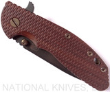 Rick Hinderer Knives Vintage Series XM-24 Spear Point folding knife with thumb stud and flipper tab - shown closed presentation side.  Black O-1 steel plain edge blade.  Textured Walnut handle with Battle Green lock side.  Model K3083S0VT00.
For reference only.