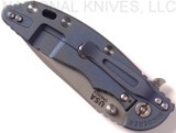 Rick Hinderer Knives XM-18 3.5" Spear Point folding knife with thumb stud and flipper tab - shown closed lock side.  Working Finish 20CV stainless steel plain edge blade.  Blue - black G-10 handle with Battle Blue lock side.  Model K2082SGW00.