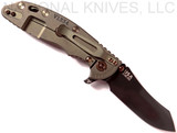 Rick Hinderer Knives Vintage Series XM-18 3.5" Skinner folding knife with thumb stud and flipper tab - shown open lock side.  Black O-1 steel plain edge blade.  Textured Walnut handle with Battle Green titanium lock side.  Model K2042S0VT00.
For reference only.