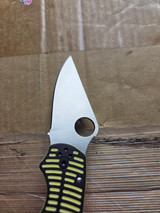 Used Spyderco Para 3 Salt folding knife with thumb hole - shown close up of blade presentation side.  Satin MagnaCut stainless steel plain edge blade.  Black and yellow G-10 handle.  Model C223GBKYLMCP.