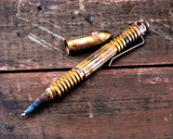 Rick Hinderer Knives Extreme Duty ink pen - shown with cap off.  Battlefield Pick Up copper construction.  Model P5802006BF.
For reference only.