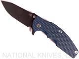 Rick Hinderer Knives Jurassic Slicer folding knife with thumb stud and flipper tab - shown open presentation side.  Battle Black 20CV stainless steel plain edge blade.  Blue - black G-10 handle with Battle Black titanium lock side.  Model K201JSGDBK.
For reference only.