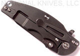 Rick Hinderer Knives Jurassic Slicer folding knife with thumb stud and flipper tab - shown closed lock side.  Battle Black 20CV stainless steel plain edge blade.  Blue - black G-10 handle with Battle Black titanium lock side.  Model K201JSGDBK.
For reference only.