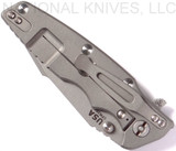 Rick Hinderer Knives Eklipse Harpoon Tanto folding knife with thumb stud and flipper tab - shown closed lock side.  Working Finish 20CV stainless steel plain edge blade.  Black G-10 handle with Working Finish lock side.  Model K4054SGW00.