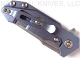 Rick Hinderer Knives Half Track folding knife with flipper tab - shown closed lock side.  Stonewash 20CV stainless steel plain edge blade.  Blue - black G-10 handle with stonewash blue titanium lock side.  Model K2009SGS00.
