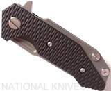 Rick Hinderer Knives Half Track Slicer folding knife with flipper tab - shown closed presentation side.  Working Finish 20CV stainless steel plain edge blade.  Black G-10 handle with Working Finish titanium lock side.  Model K2009SGS00.