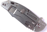 Rick Hinderer Knives XM-18 3.5" Harpoon Spanto folding knife with thumb stud and flipper tab - shown closed lock side.  Stonewash 20CV stainless steel plain edge blade.  OD green - black G-10 handle with stonewash lock side.  Model K2552SGS00.