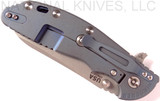 Rick Hinderer Knives XM-24 Sheepsfoot folding knife with thumb stud and flipper tab - shown closed lock side.  Working Finish 20CV stainless steel plain edge blade.  Blue - black G-10 handle with Battle Blue lock side.  Model K3073SGW00.
