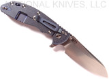 Rick Hinderer Knives XM-24 Sheepsfoot folding knife with thumb stud and flipper tab - shown open lock side.  Stonewash 20CV stainless steel plain edge blade.  Blue - black G-10 handle with stonewash blue lock side.  Model K3073SGS00.
