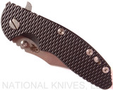 Rick Hinderer Knives XM-18 3.5" Bowie folding knife with thumb stud and flipper tab - shown closed presentation side.  Stonewash 20CV stainless steel plain edge blade.  Black G-10 handle with stonewash titanium lock side.  Model K2032SGS00.