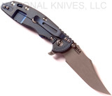 Rick Hinderer Knives XM-18 3.5" Bowie folding knife with thumb stud and flipper tab - shown open lock side.  Working Finish 20CV stainless steel plain edge blade.  Blue G-10 handle with Battle Blue titanium lock side.  Model K2032SGW00.