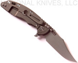 Rick Hinderer Knives XM-18 3.5" Bowie folding knife with thumb stud and flipper tab - shown open lock side.  Working Finish 20CV stainless steel plain edge blade.  Black G-10 handle with Battle Bronze titanium lock side.  Model K2032SGW00.