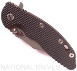 Rick Hinderer Knives XM-18 3.5" Bowie folding knife with thumb stud and flipper tab - shown closed presentation side.  Working Finish 20CV stainless steel plain edge blade.  Black G-10 handle with Battle Bronze titanium lock side.  Model K2032SGW00.