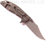 Rick Hinderer Knives XM-18 3.5" Bowie folding knife with thumb stud and flipper tab - shown open lock side.  Working Finish 20CV stainless steel plain edge blade.  Coyote G-10 handle with Battle Bronze titanium lock side.  Model K2032SGW00.