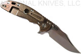 Rick Hinderer Knives XM-18 3.5" Bowie folding knife with thumb stud and flipper tab - shown open lock side.  Stonewash 20CV stainless steel plain edge blade.  OD green - black G-10 handle with stonewash bronze titanium lock side.  Model K2032SGS00.
