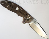 Rick Hinderer Knives XM-18 3.5" Spanto folding knife with thumb stud and flipper tab - shown open lock side.  Stonewash S45VN stainless steel plain edge blade.  Black G-10 handle with stonewash bronze lock side.  Model K2002SGS00.