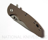 Rick Hinderer Knives XM-18 3.5" Spanto folding knife with thumb stud and flipper tab - shown closed presentation side.  Working Finish S45VN stainless steel plain edge blade.  FDE G-10 handle with Battle Bronze lock side.  Model K2002SGW00.
