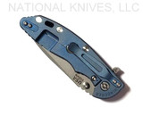 Rick Hinderer Knives XM-18 3.5" Spanto folding knife with thumb stud and flipper tab - shown closed lock side.  Working Finish S45VN stainless steel plain edge blade.  Blue G-10 handle with Battle Blue lock side.  Model K2002SGW00.