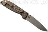 Rick Hinderer Knives Firetac Recurve folding knife with thumb disk - shown open lock side.  Working Finish 20CV stainless steel plain edge blade.  Black G-10 handle with Battle Bronze lock side.  Model K205FSGW00.