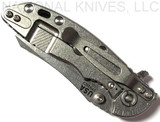 Rick Hinderer Knives XM-18 3.0" Skinner folding knife with thumb studs and flipper tab - shown closed lock side.  Stonewashed 20CV stainless steel plain edge blade.  Black G-10 handle with stonewashed lock side.  Model K1041SGS00.