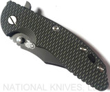 Rick Hinderer Knives XM-18 3.5" Bowie folding knife with thumb stud and flipper tab - shown closed presentation side.  Battle Black 20CV stainless steel plain edge blade.  OD green - black G-10 handle with Battle Black titanium lock side.  Model K20320SNNC.
