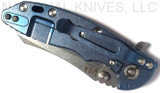 Rick Hinderer Knives XM-18 3.0" Skinner folding knife with thumb studs and flipper tab - shown closed lock side.  Stonewashed 20CV stainless steel plain edge blade.  Blue G-10 handle with stonewashed blue lock side.  Model K1041SGS00.