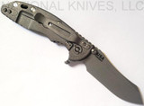Rick Hinderer Knives XM-18 3.0" Skinner folding knife with thumb studs and flipper tab - shown open lock side.  Working Finish 20CV stainless steel plain edge blade.  Black G-10 handle with Working Finish lock side.  Model K1041SGW00.