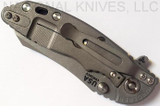 Rick Hinderer Knives XM-18 3.0" Skinner folding knife with thumb studs and flipper tab - shown closed lock side.  Working Finish 20CV stainless steel plain edge blade.  Black G-10 handle with Working Finish lock side.  Model K1041SGW00.