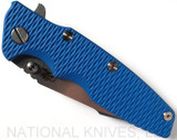 Rick Hinderer Knives Eklipse Harpoon Spanto folding knife with thumb stud and flipper tab - shown closed presentation side.  Stonewash 20CV stainless steel plain edge blade.  Blue G-10 handle with stonewash bronze lock side.  Model K40442SGS00.