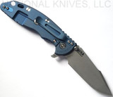 Rick Hinderer Knives Skinny XM-18 3.5" Harpoon Spanto folding knife with thumb stud and flipper tab - shown open lock side.  Working Finish 20CV stainless steel plain edge blade.  Blue G-10 handle with Battle Blue lock side.  Model K2555SGW00.