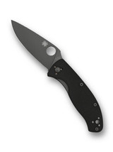 Spyderco Tenacious folding knife with thumb hole - shown open presentation side.  Black 8Cr13MoV stainless steel plain edge blade.  Black G-10 handle.  C122GBBKP.