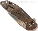 Rick Hinderer Knives XM-18 3.5" Slicer folding knife with thumb stud and flipper tab - shown closed lock side.  Stonewash 20CV stainless steel plain edge blade.  Coyote G-10 handle with stonewash bronze lock side.  Model K310102S000.