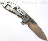 Rick Hinderer Knives XM-18 3.5" Slicer folding knife with thumb stud and flipper tab - shown open lock side.  Stonewash 20CV stainless steel plain edge blade.  Translucent Green G-10 handle with stonewash lock side.  Model K310102S000.

