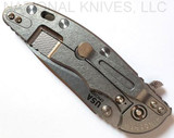 Rick Hinderer Knives XM-18 3.5" Slicer folding knife with thumb stud and flipper tab - shown closed lock side.  Stonewash 20CV stainless steel plain edge blade.  Translucent Green G-10 handle with stonewash lock side.  Model K310102S000.
