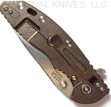 Rick Hinderer Knives XM-18 3.5" Slicer folding knife with thumb stud and flipper tab - shown closed lock side.  Stonewash 20CV stainless steel plain edge blade.  OD green G-10 handle with stonewash bronze lock side.  Model K310102S000.