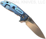 Rick Hinderer Knives XM-18 3.5" Slicer folding knife with thumb stud and flipper tab - shown open lock side.  Stonewash 20CV stainless steel plain edge blade.  Blue - black G-10 handle with stonewash blue lock side.  Model K310102S000.