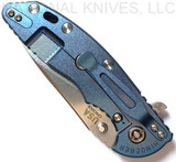Rick Hinderer Knives XM-18 3.5" Slicer folding knife with thumb stud and flipper tab - shown closed lock side.  Stonewash 20CV stainless steel plain edge blade.  Blue - black G-10 handle with stonewash blue lock side.  Model K310102S000.