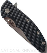 Rick Hinderer Knives XM-18 3.5" Slicer folding knife with thumb stud and flipper tab - shown closed presentation side.  Stonewash 20CV stainless steel plain edge blade.  Black G-10 handle with stonewash blue titanium lock side.  Model K2012SGS00.